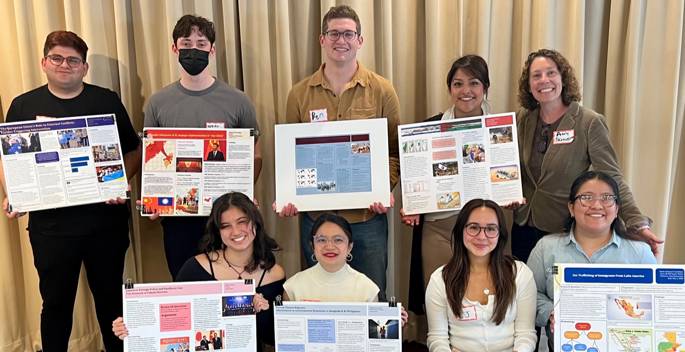 IR students with their posters for the CURE Research Showcase