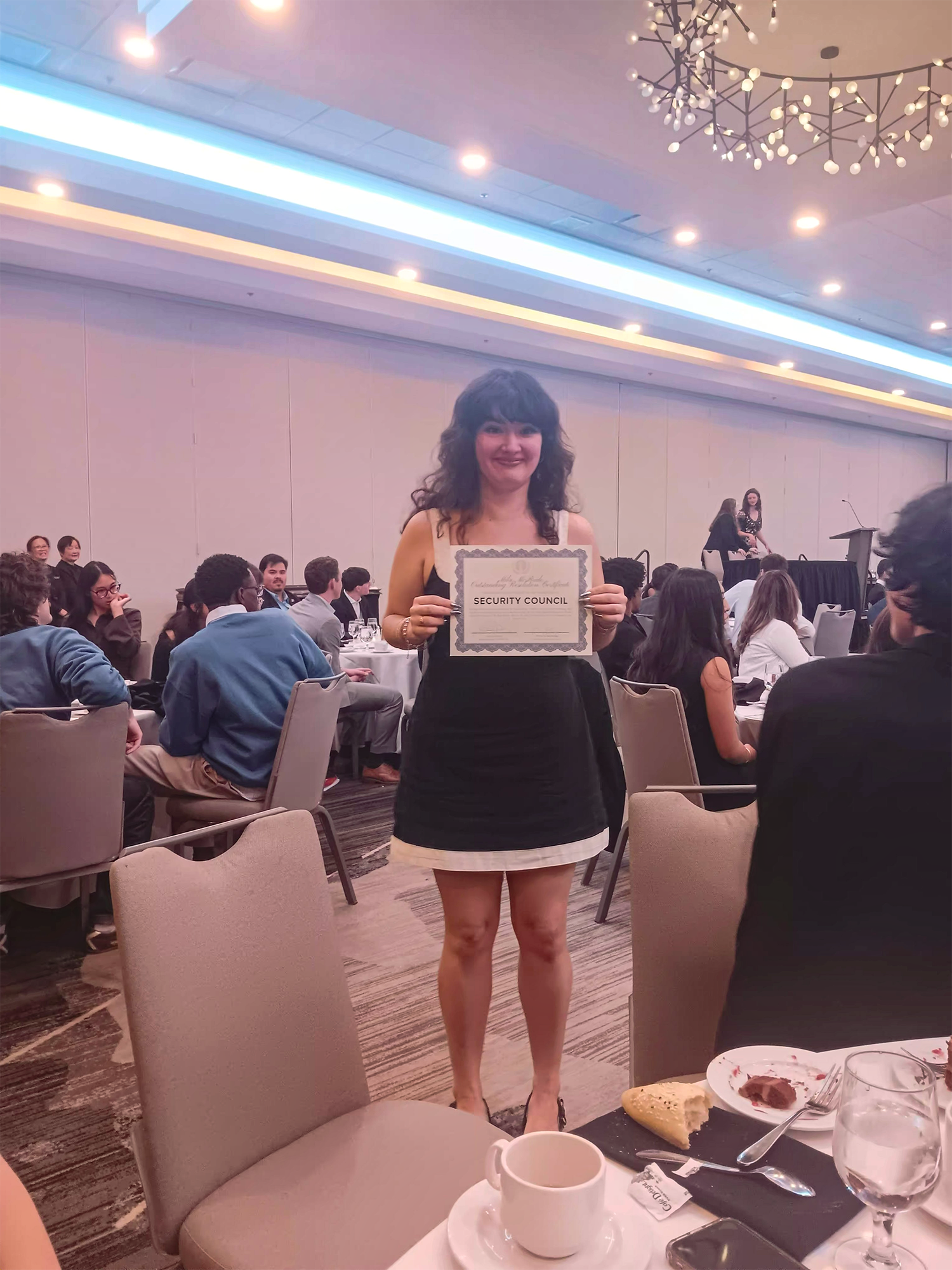 A student accepting an award